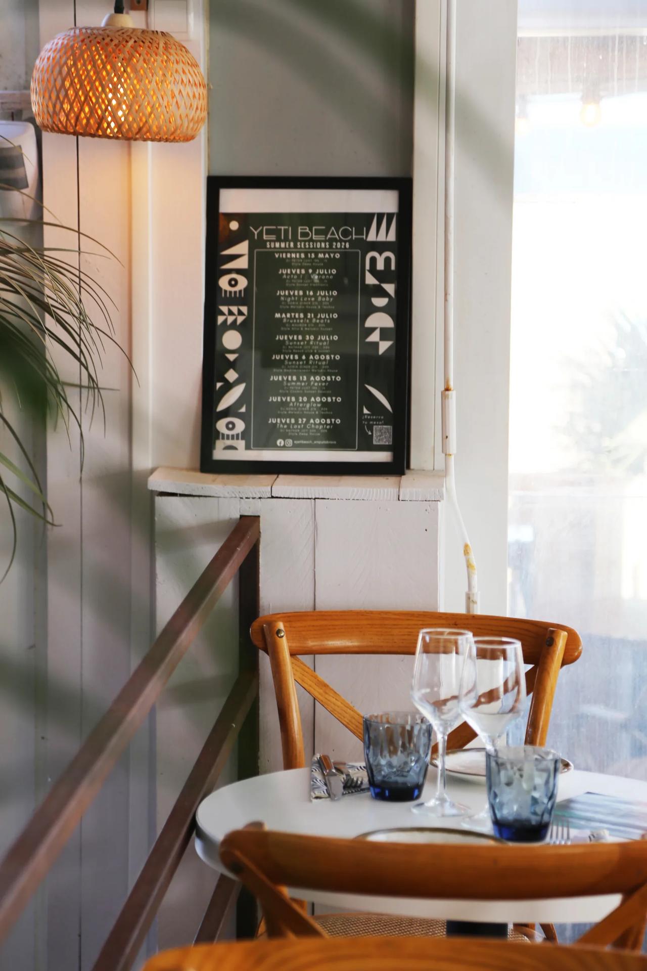 Interior of Yeti Restaurante featuring a menu and table setting.