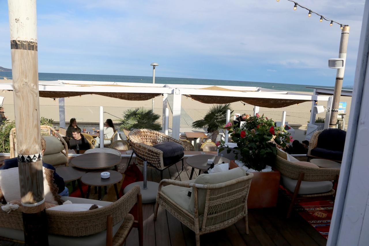 Outdoor seating area at a beachside restaurant
