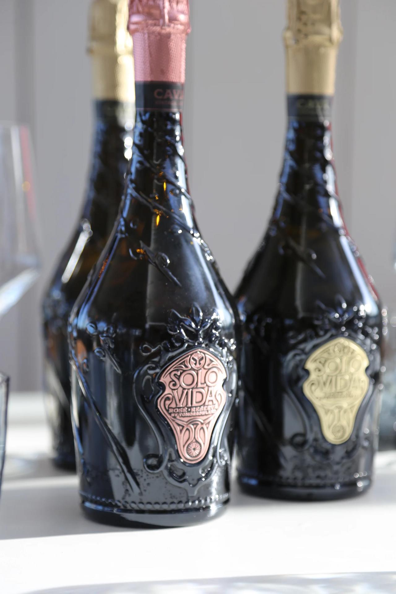 Bottles of Solo Vida sparkling wine with decorative labels